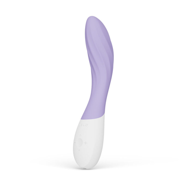 Vibrador curvo morado y blanco sobre fondo blanco
